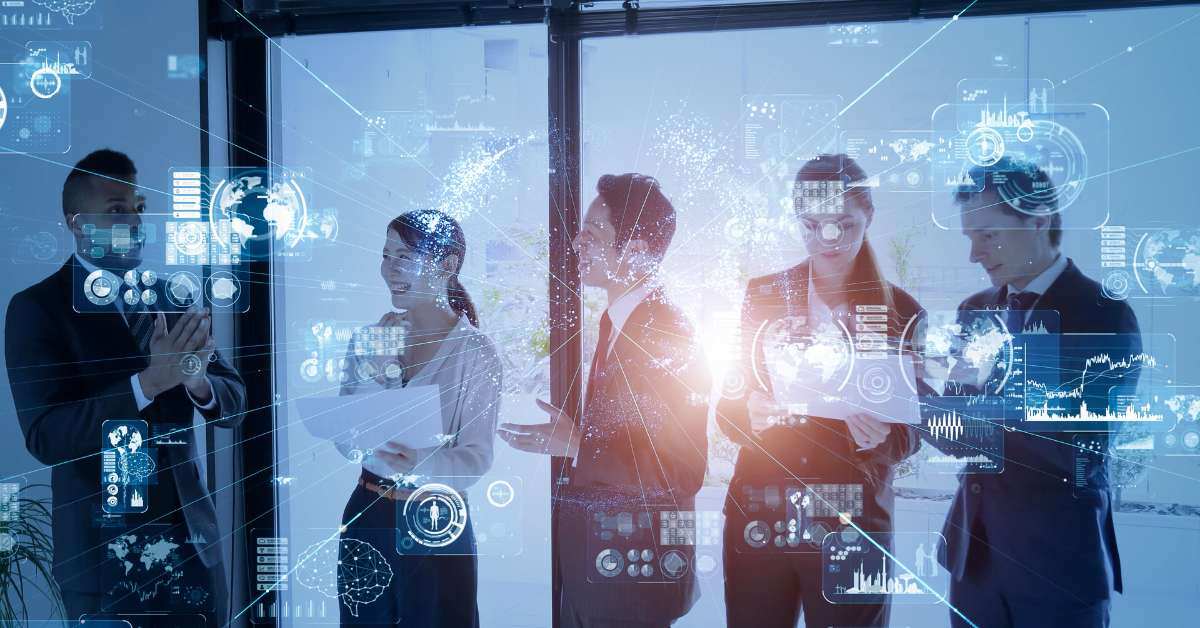 Employees gather around and study an AI generated screen with holograms of data sets for their company