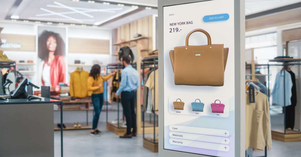 Image of a digital board with purses that can be purchased using their self checkout kiosk.